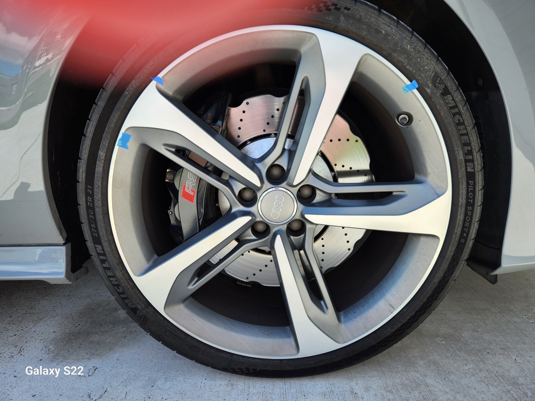 Audi RS wheel marked with painter's tape before repair